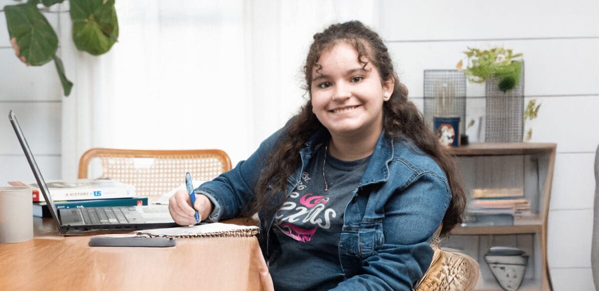Girl smiling and studying